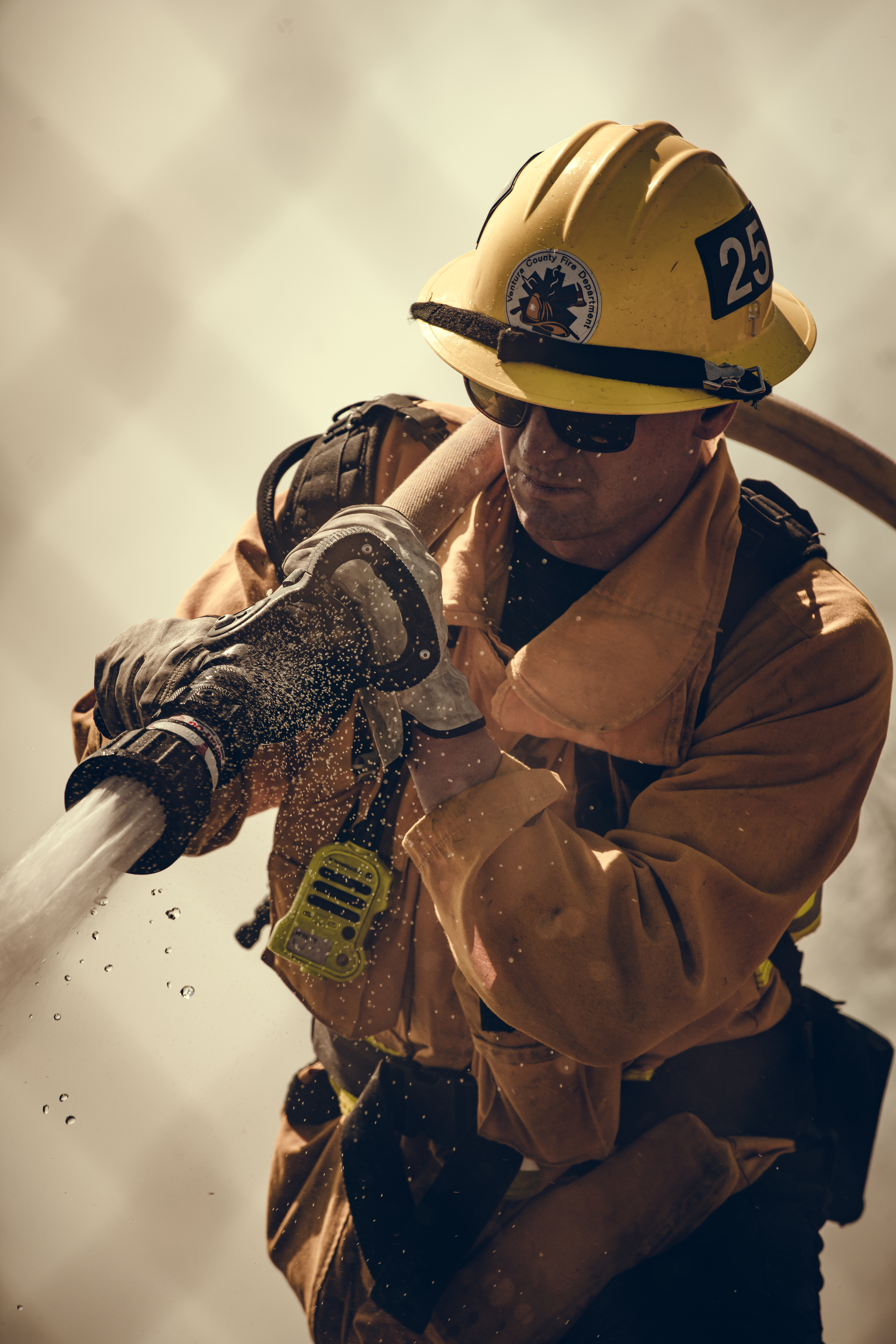 Firefighter Using a Fire Hose 